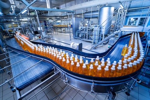 Beverage manufacturing facility with automated bottling and production equipment