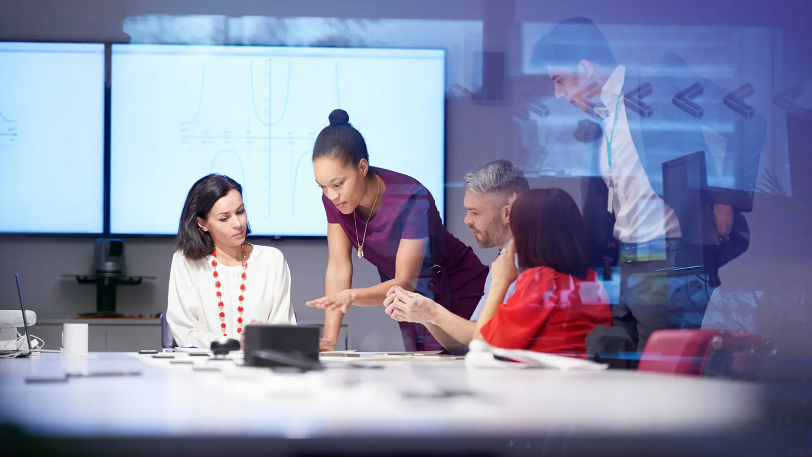 Financial advisors reviewing commercial energy project economics and investment analysis