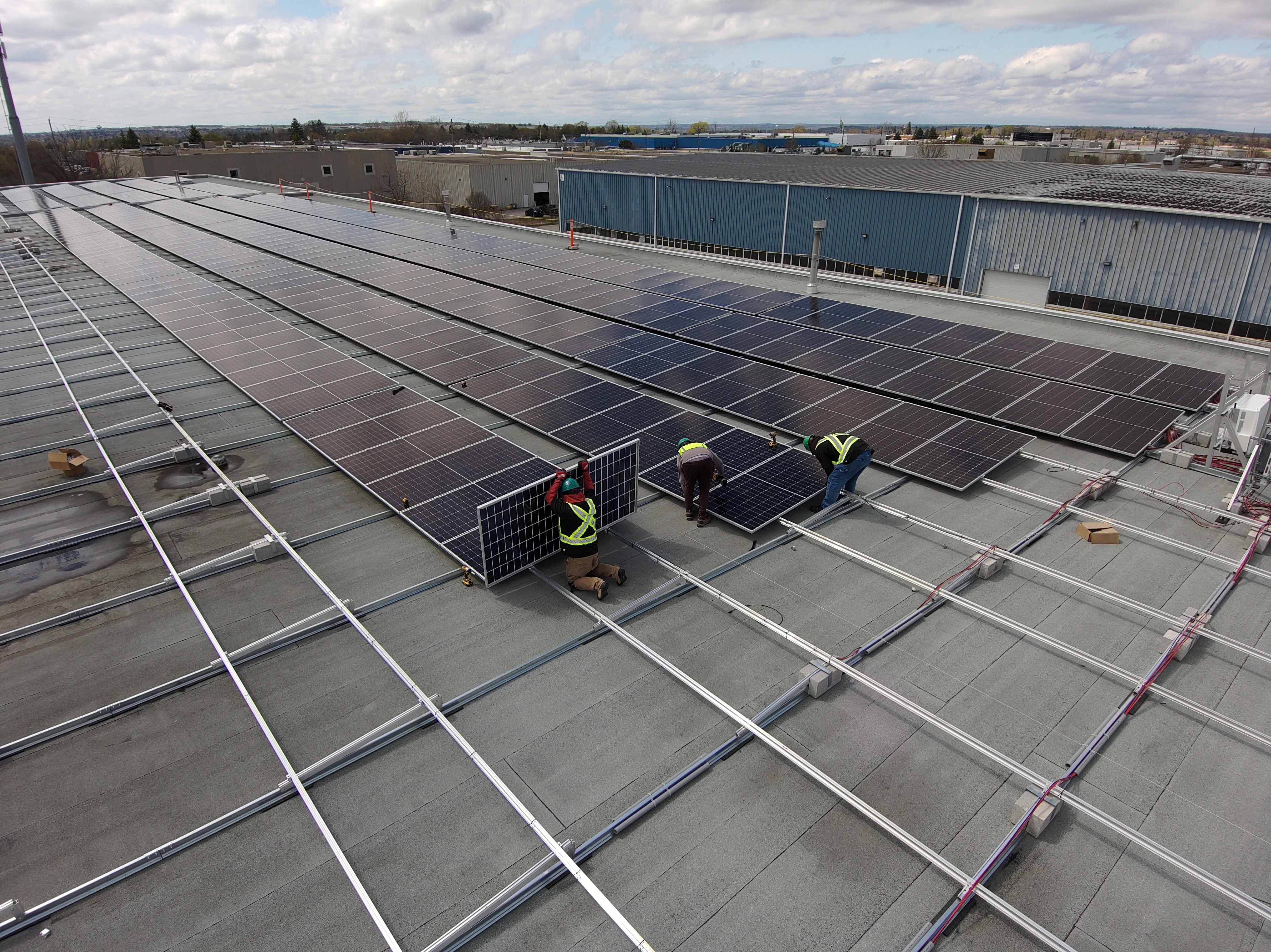Green Integrations crew during a commercial rooftop installation in Ontario.