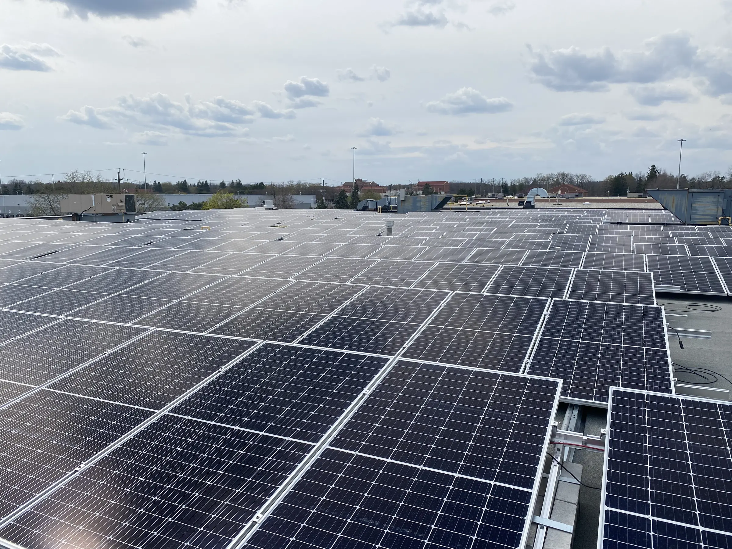 Hero — 353.8 kW rooftop solar for an automotive collision repair facility in Oakville, Ontario